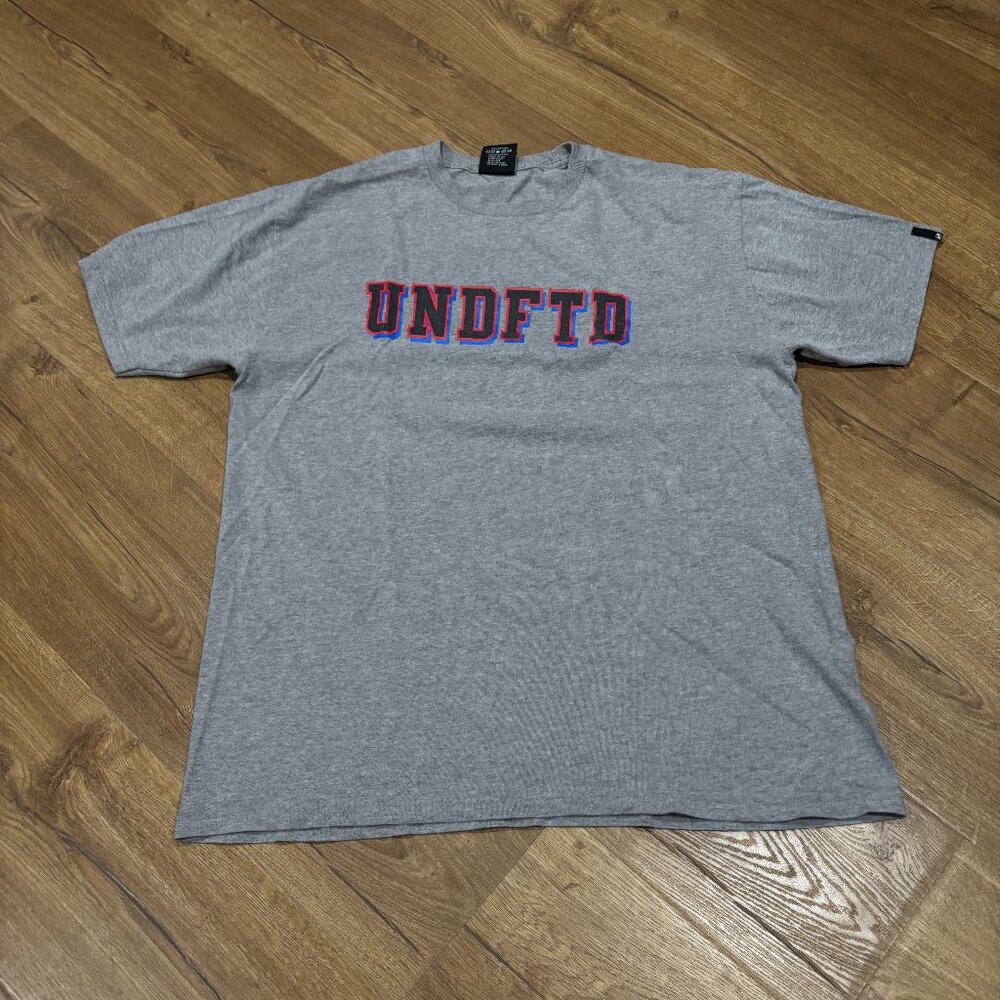 Undefeated Heather Grey Red Black And Blue Logo Graphic Shirt